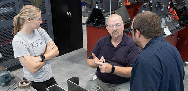 Students in IMEC listening to instructor